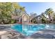 View of community pool and clubhouse on sunny day at 1465 Farrindon Cir # 1465, Lake Mary, FL 32746