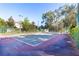 Exterior view of a tennis court with mature landscaping at 1465 Farrindon Cir # 1465, Lake Mary, FL 32746