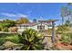 Picturesque backyard featuring manicured landscaping, perfect for relaxation and outdoor enjoyment at 1533 Legend Ct, Deltona, FL 32738
