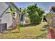 Lush backyard with tropical foliage providing shade and a peaceful outdoor setting at 1533 Legend Ct, Deltona, FL 32738