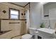 Bathroom featuring decorative tile, updated sink and fixtures at 1533 Legend Ct, Deltona, FL 32738