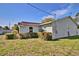 Exterior view of home with well-maintained landscaping and privacy shrubs at 1533 Legend Ct, Deltona, FL 32738