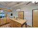 A well-lit kitchen with wood cabinets and an island offers ample storage space at 1533 Legend Ct, Deltona, FL 32738