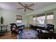 Inviting living room with floral chairs and natural light at 1533 Legend Ct, Deltona, FL 32738