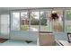 Cozy sunroom with tile floors and serene backyard view at 1533 Legend Ct, Deltona, FL 32738
