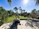 Expansive backyard featuring a concrete patio with a grill and outdoor seating, perfect for entertaining at 1551 7Th Ave, Deland, FL 32724