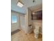 Bathroom with a shower and tub combo, tile floors, and toilet at 1551 7Th Ave, Deland, FL 32724