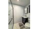 Bathroom with a glass enclosed shower, vanity, toilet, and neutral color scheme at 1551 7Th Ave, Deland, FL 32724