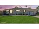 Charming single-story home with a well-manicured front lawn and an attached two-car garage at 1551 7Th Ave, Deland, FL 32724