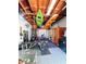 Finished garage with gym, sauna, and kayaks mounted to the ceiling for space saving storage at 1551 7Th Ave, Deland, FL 32724