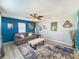 Cozy living room featuring modern decor, a ceiling fan, and a comfortable gray sofa at 1551 7Th Ave, Deland, FL 32724