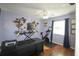 Home office with modern desk setup, exercise bike, hardwood flooring, and natural light at 1551 7Th Ave, Deland, FL 32724