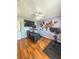 Spacious office featuring a desk, work-out area, wood floors, and unique world map wall decor at 1551 7Th Ave, Deland, FL 32724