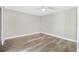 A clean, spacious bedroom is well-lit and features updated hardwood floors at 171 Moonstone Ct, Port Orange, FL 32129
