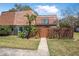 Charming two-story home with well-kept lawn, wood fence, and mature landscaping for added privacy at 171 Moonstone Ct, Port Orange, FL 32129