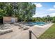 Sparkling pool with lounge chairs and surrounding greenery, perfect for relaxation at 171 Moonstone Ct, Port Orange, FL 32129