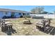 Backyard with a fire pit, benches, above ground pool and fenced-in yard at 1767 Valencia Ave, Ormond Beach, FL 32174