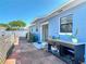 Backyard featuring a brick patio, blue exterior, and an outdoor sink with counter at 1767 Valencia Ave, Ormond Beach, FL 32174