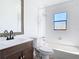 A clean bathroom features a shower over tub and tiled backsplash mirror at 1767 Valencia Ave, Ormond Beach, FL 32174