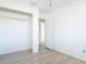 Bedroom featuring wood-look floors, window and closet at 1767 Valencia Ave, Ormond Beach, FL 32174