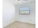 This bedroom features neutral walls, ceiling fan, and wood-look tile flooring at 1767 Valencia Ave, Ormond Beach, FL 32174