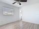 Bedroom with wood-look floors, window and ceiling fan at 1767 Valencia Ave, Ormond Beach, FL 32174
