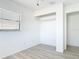 Bedroom with wood-look floors, window and closet with built-in shelving at 1767 Valencia Ave, Ormond Beach, FL 32174