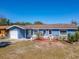 Charming home exterior with a well-maintained lawn and manicured landscaping at 1767 Valencia Ave, Ormond Beach, FL 32174