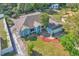 An aerial view highlighting the landscaping and curb appeal of this lovely light blue home with a garage at 1877 N Merrick Dr # 0, Deltona, FL 32738