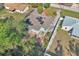 An aerial perspective showcases a well-maintained home with a beautiful backyard and solar panels on the roof at 1877 N Merrick Dr # 0, Deltona, FL 32738