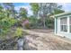 Private backyard with a brick patio, garden area, and a view of lush greenery at 1877 N Merrick Dr # 0, Deltona, FL 32738