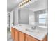 Bathroom featuring a double sink vanity with new countertops and a large mirror at 1877 N Merrick Dr # 0, Deltona, FL 32738