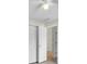 Bedroom featuring closet with folding doors, ceiling fan, and doorway to another room at 1877 N Merrick Dr # 0, Deltona, FL 32738