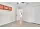 Bright bedroom with tile floors, bright walls and overhead storage cabinets at 1877 N Merrick Dr # 0, Deltona, FL 32738