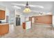 Spacious living room featuring tile floors and stainless steel kitchen appliances overlooking the dining area at 1877 N Merrick Dr # 0, Deltona, FL 32738