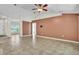 Inviting living room featuring neutral wall color, tile floors, ceiling fan and is connected to other rooms at 1877 N Merrick Dr # 0, Deltona, FL 32738