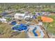 An aerial view of a community playground and waterpark with modern play equipment and Gathering-friendly amenities at 1877 N Merrick Dr # 0, Deltona, FL 32738