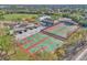 An aerial view of multiple tennis courts and basketball courts in a recreational community area at 1877 N Merrick Dr # 0, Deltona, FL 32738