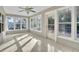 Light-filled sun room featuring large windows and tiled floor, perfect for relaxing at 1877 N Merrick Dr # 0, Deltona, FL 32738