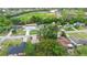 Aerial view of a residential neighborhood with a nearby ball field and green spaces at 1880 N Merrick Dr, Deltona, FL 32738