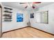 Bright bedroom with hardwood floors, a large window, and unique decor at 1880 N Merrick Dr, Deltona, FL 32738