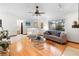 Bright living room featuring hardwood floors, recessed lighting, and a large window at 1880 N Merrick Dr, Deltona, FL 32738