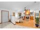 Open-concept living room featuring hardwood floors, fireplace, and bright, natural light at 1880 N Merrick Dr, Deltona, FL 32738
