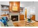 Comfortable living room featuring a fireplace, hardwood floors, and an open layout at 1880 N Merrick Dr, Deltona, FL 32738