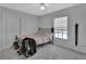 This bedroom offers a ceiling fan and a window view overlooking the outside pool at 1963 Stacey Cir, Deltona, FL 32738
