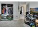 Bright bedroom features open closet space, natural light, and television entertainment area at 1963 Stacey Cir, Deltona, FL 32738
