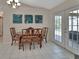 Cozy dining area with a table and chairs, access to the patio, and ample natural light at 1963 Stacey Cir, Deltona, FL 32738