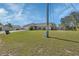 Single-Gathering home with a well-kept lawn, front door and a two-car garage in a residential area at 1963 Stacey Cir, Deltona, FL 32738