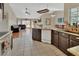 Modern kitchen with tiled floor and an open view of the living room at 1963 Stacey Cir, Deltona, FL 32738
