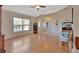 Bright living room featuring wood floors, neutral walls and modern ceiling fan at 1963 Stacey Cir, Deltona, FL 32738